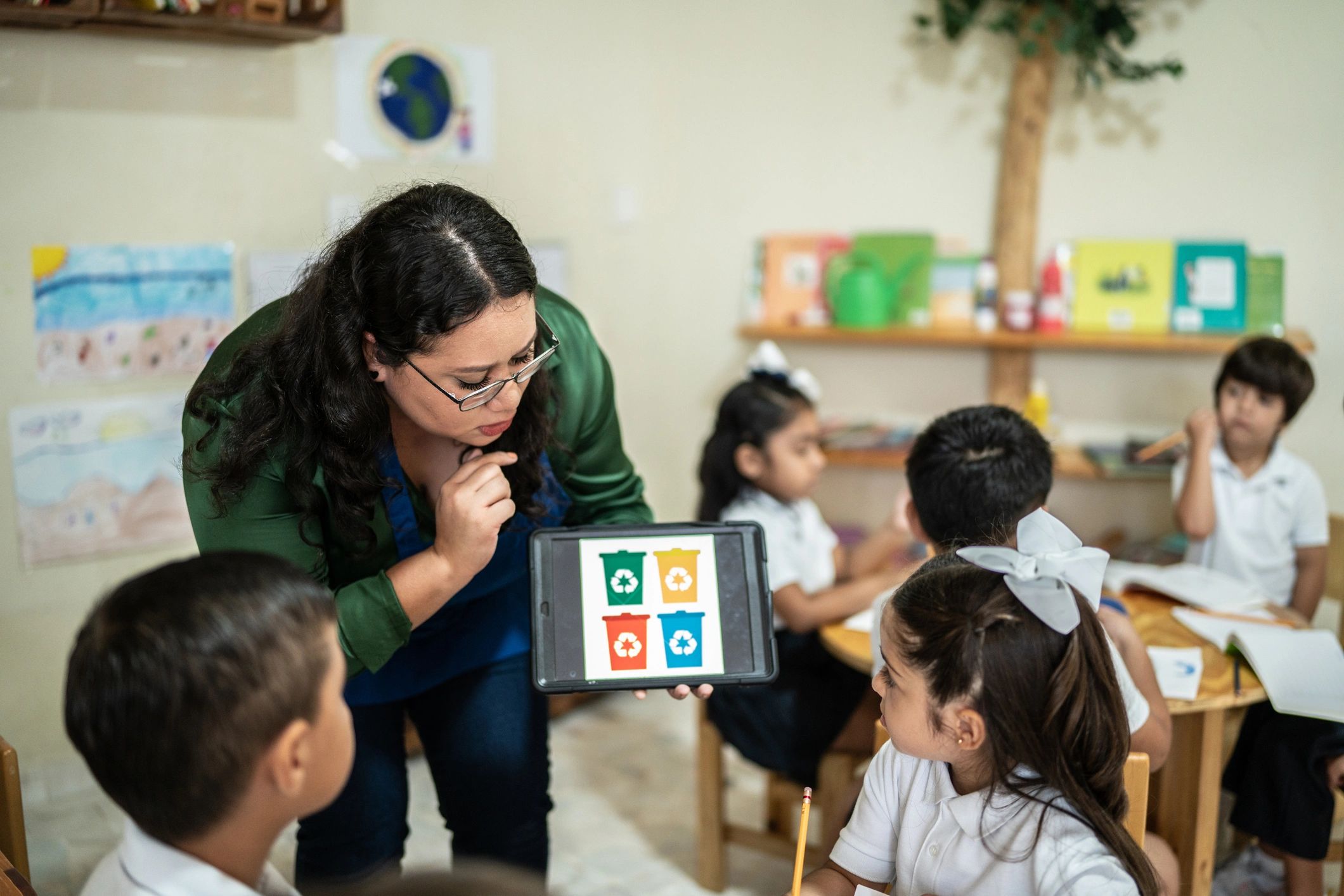Teacher speaking with children in a classroom