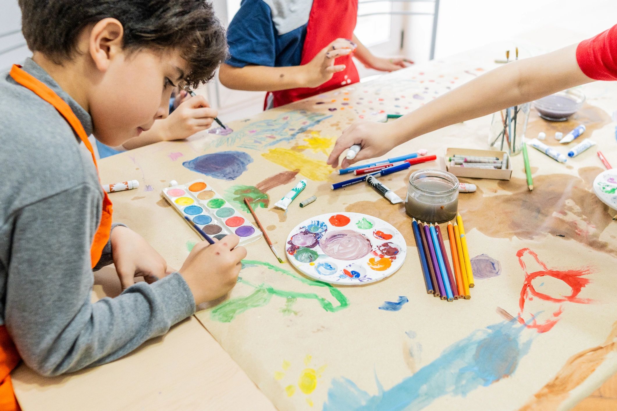 Child painting during a school art activity