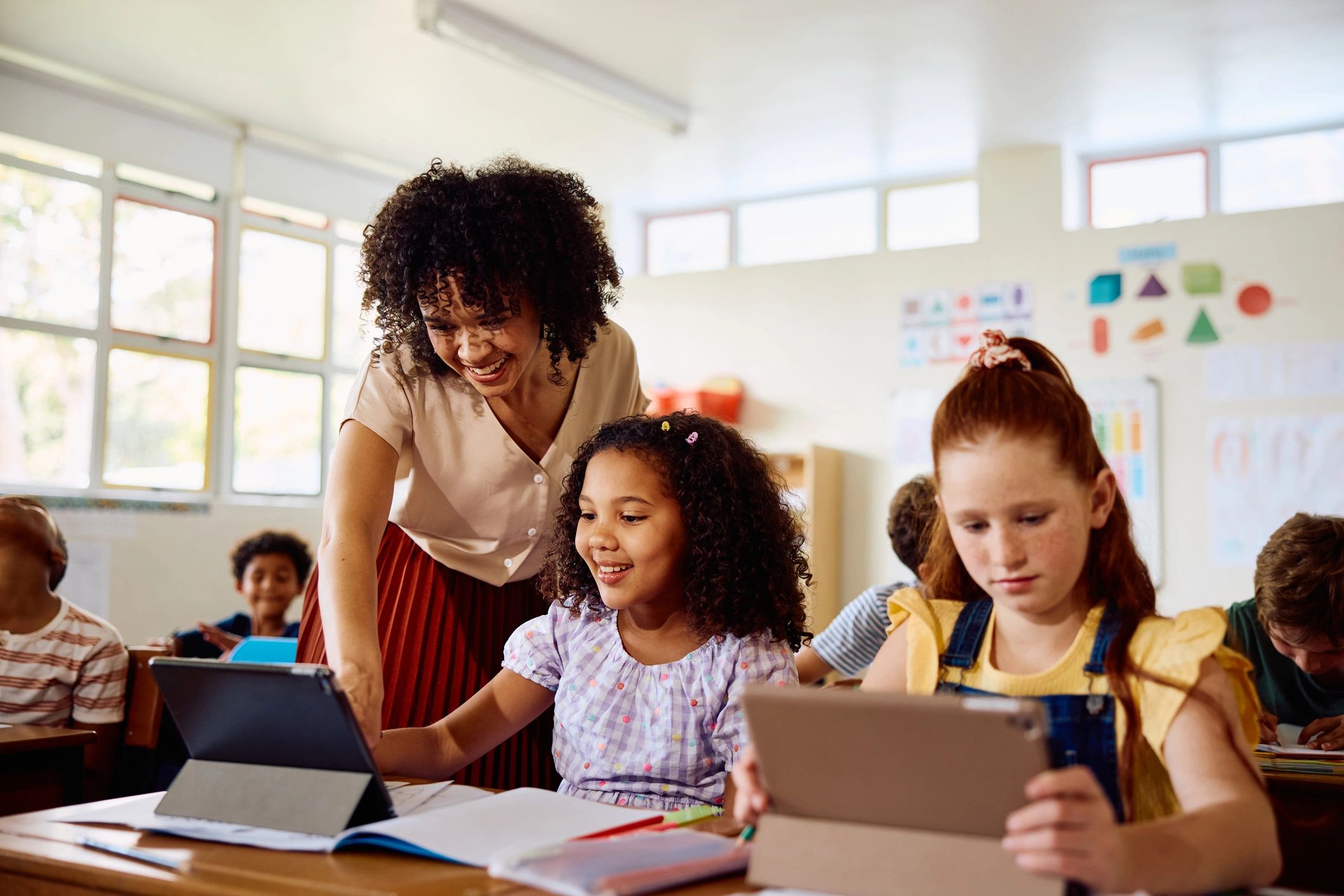 Teacher supporting children during a learning activity