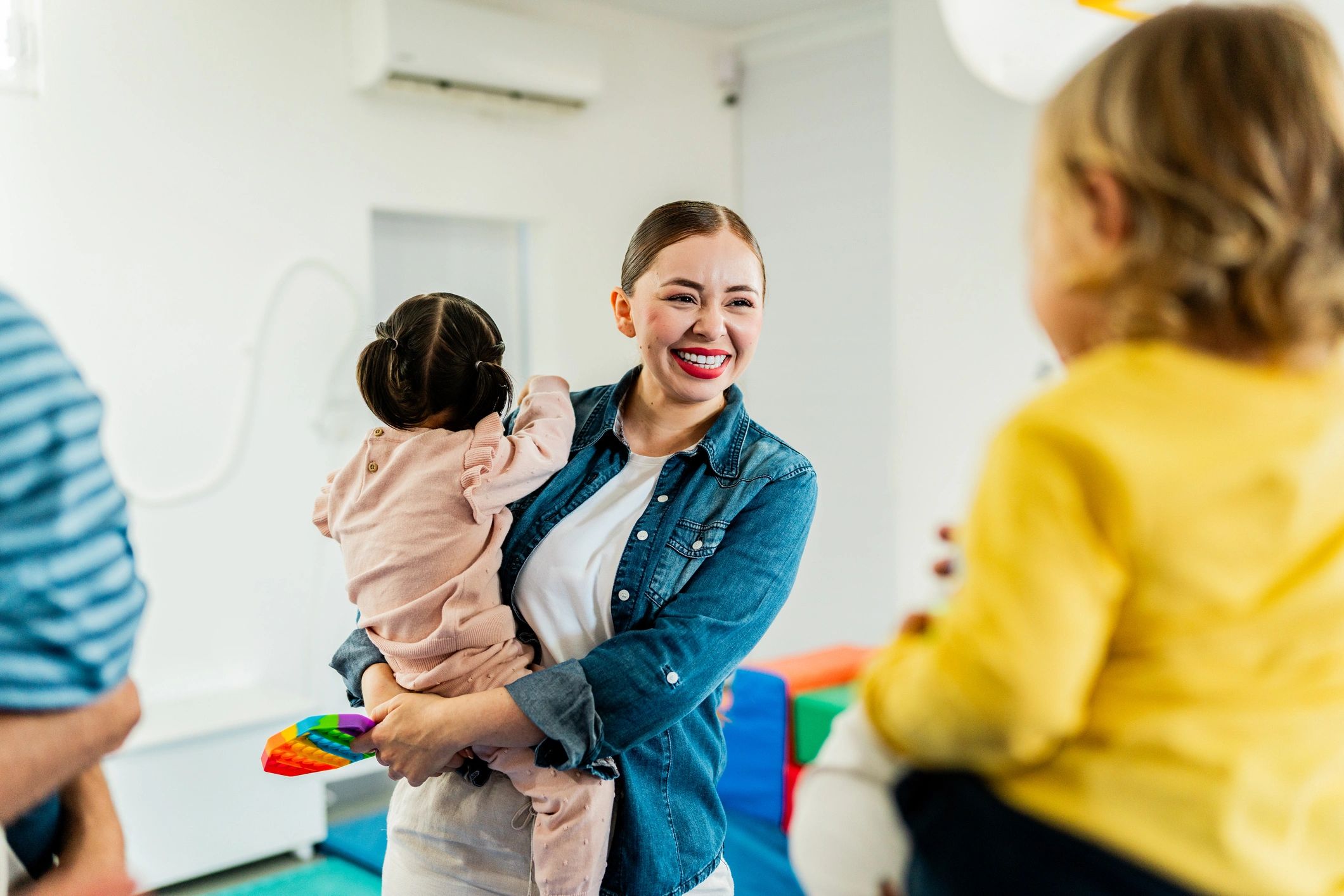 Parent holding a baby at a family support group